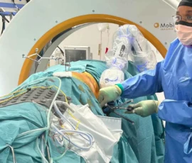 Mr. Taofiq Desmond Sanusi performing robotic-assisted complex spine surgery with navigation guidance